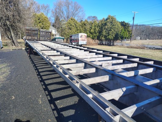 Heavy equipment trailer frame prepared for coating